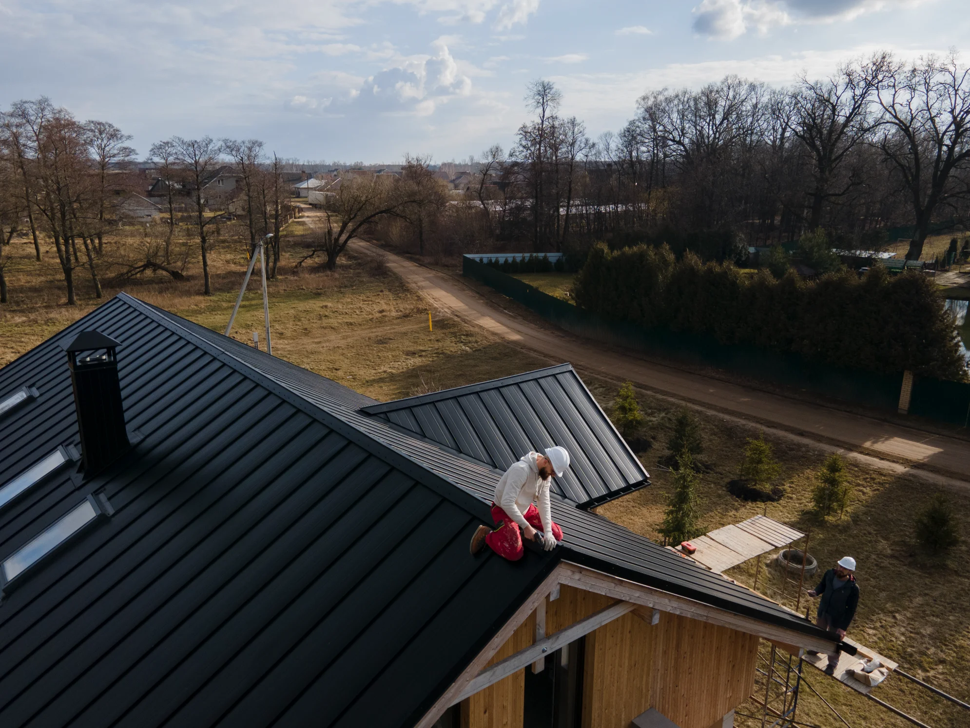 Roofer repairing metal roof North Georgia
